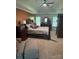 This is a primary bedroom with a king size bed, ceiling fan, and matching dark wood furniture at 503 Bridgestone Ct, Gastonia, NC 28056
