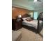 This is a primary bedroom with a king size bed, ceiling fan, and matching dark wood furniture at 503 Bridgestone Ct, Gastonia, NC 28056