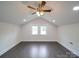 Finished attic space offers vaulted ceilings, hardwood floors, and natural lighting at 511 Hasty St, Marshville, NC 28103