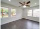 Bedroom with three large windows and wood-look floors provides great natural light at 511 Hasty St, Marshville, NC 28103