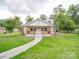 Charming single-story home with a welcoming front porch and well-maintained lawn and walkway at 511 Hasty St, Marshville, NC 28103
