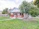 Attractive home exterior with a charming covered porch, complemented by mature trees at 511 Hasty St, Marshville, NC 28103