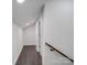 Hallway with hardwood floors and white trim, with access to other rooms at 511 Hasty St, Marshville, NC 28103