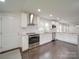 Modern kitchen design with stainless steel appliances and a view into the living area at 511 Hasty St, Marshville, NC 28103