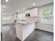 Well-lit kitchen featuring granite countertops, stainless steel appliances, and ample cabinet space at 511 Hasty St, Marshville, NC 28103