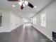 Open living space with sleek floors, recessed lighting, and views into kitchen area at 511 Hasty St, Marshville, NC 28103
