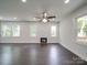 Bright living area featuring wood-look floors and a modern electric fireplace at 511 Hasty St, Marshville, NC 28103