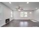 Inviting living room with dark floors, a contemporary electric fireplace, and a welcoming front door at 511 Hasty St, Marshville, NC 28103