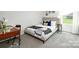 Bedroom featuring a bed, desk, and a large window with an outdoor view at 5232 Reedy Ridge Rd, Charlotte, NC 28215