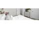 Serene bedroom featuring crisp white linens, decorative accents, and a stylish dresser with white paneled doors at 5232 Reedy Ridge Rd, Charlotte, NC 28215