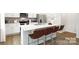 Modern kitchen with a large island, stainless steel appliances, and bar stool seating at 5232 Reedy Ridge Rd, Charlotte, NC 28215