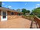 Enjoy outdoor living on this back deck with a railing and views of the backyard at 5301 Baker Dr, Charlotte, NC 28210