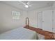 Bedroom featuring wood floors, ceiling fan, and natural light at 5301 Baker Dr, Charlotte, NC 28210