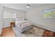 Bedroom featuring wood floors, soft light and a neutral palette at 5301 Baker Dr, Charlotte, NC 28210