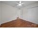 Bright bedroom with hardwood floors, closet, and fresh paint at 5301 Baker Dr, Charlotte, NC 28210