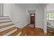 Welcoming foyer featuring hardwood floors and a charming front door at 5301 Baker Dr, Charlotte, NC 28210