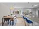Eat-in kitchen with a table and bench, island seating, and stainless appliances at 5301 Baker Dr, Charlotte, NC 28210