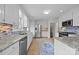 Updated kitchen with stainless appliances and tile backsplash at 5301 Baker Dr, Charlotte, NC 28210