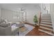 Bright living room features modern furniture, ceiling fan, and hardwood floors at 5301 Baker Dr, Charlotte, NC 28210