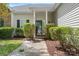 Inviting home entrance featuring a black front door, manicured landscaping, and a well-lit walkway at 5927 Patricia Ryan Dr, Charlotte, NC 28216