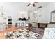 Comfortable living room with open floor plan, hardwood floors, and a decorative rug at 5927 Patricia Ryan Dr, Charlotte, NC 28216