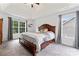 Comfortable main bedroom with tray ceiling, large window, and wood accents at 5927 Patricia Ryan Dr, Charlotte, NC 28216