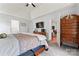 Main bedroom featuring a trey ceiling, adjoining bathroom, and an array of windows at 5927 Patricia Ryan Dr, Charlotte, NC 28216
