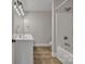 A bathroom features double sinks, a shower-tub, and modern lighting at 63 Frost Ln, Taylorsville, NC 28681