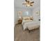 A stylish bedroom with soft carpet, a bench, and tasteful décor, creating a cozy retreat at 63 Frost Ln, Taylorsville, NC 28681