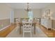 Traditional dining room with hardwood floors, chandelier, and ample natural light from the window at 63 Frost Ln, Taylorsville, NC 28681