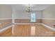 Elegant dining room featuring hardwood floors, a chandelier, and classic wainscoting at 63 Frost Ln, Taylorsville, NC 28681