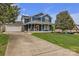 Beautiful two-story home with an inviting front porch, attached garage and long drive way at 63 Frost Ln, Taylorsville, NC 28681