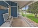 Inviting front porch with rocking chairs and a welcome bench, perfect for relaxing outdoors at 63 Frost Ln, Taylorsville, NC 28681