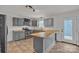 Remodeled kitchen with grey cabinetry, butcher block countertops, and stainless steel appliances at 63 Frost Ln, Taylorsville, NC 28681