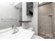 Updated bathroom with standup shower, modern fixtures, and stylish cabinet at 6325 Elmwood Cir, Charlotte, NC 28214