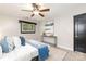 Comfortable bedroom with ceiling fan, modern decor, and updated flooring at 6325 Elmwood Cir, Charlotte, NC 28214