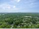 Aerial view of a neighborhood with lush green trees and well-maintained lawns, showcasing a picturesque community at 6339 Montpelier Rd, Charlotte, NC 28210
