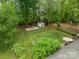 Expansive backyard featuring mature trees, patio area, storage shed, and plenty of room to relax or entertain guests at 6339 Montpelier Rd, Charlotte, NC 28210