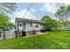 Inviting backyard featuring a charming brick patio, an outdoor grill, and well-maintained green space at 6339 Montpelier Rd, Charlotte, NC 28210