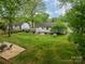 Large, well-maintained backyard with a patio, ample green space, storage shed, and established landscaping at 6339 Montpelier Rd, Charlotte, NC 28210