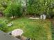 Spacious backyard with lush green grass, a patio, hammock, and mature trees, offering a private outdoor space at 6339 Montpelier Rd, Charlotte, NC 28210