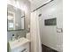 Clean bathroom featuring a white subway tile shower with a black shower head, a black framed mirror and stylish black accents at 6339 Montpelier Rd, Charlotte, NC 28210