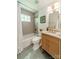 Updated bathroom boasts stylish vanity and shower with modern tile at 6339 Montpelier Rd, Charlotte, NC 28210