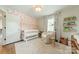 Charming Bedroom boasts stylish accent wall and comfortable seating at 6339 Montpelier Rd, Charlotte, NC 28210