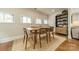 Well lit dining room features a dining table and hardwood floors at 6339 Montpelier Rd, Charlotte, NC 28210