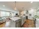 Bright, open kitchen with an island, a wine cooler, and a seamless transition to the living area at 6339 Montpelier Rd, Charlotte, NC 28210