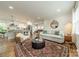 Spacious living room with hardwood floors flowing into an adjacent kitchen and dining area at 6339 Montpelier Rd, Charlotte, NC 28210