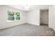 Bright bedroom with a large window and plush carpeting at 6524 Robert St, Huntersville, NC 28078
