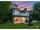 Beautiful two-story home with a well-manicured lawn, inviting porch, and professional landscaping at 6524 Robert St, Huntersville, NC 28078