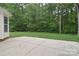 View of home's patio and lush backyard, creating a private and serene outdoor space at 7206 Forrest Rader Dr, Mint Hill, NC 28227